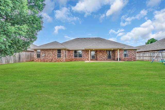1204 Sheryl Ln, Altus, OK 73521 - rear view of house featuring brick siding