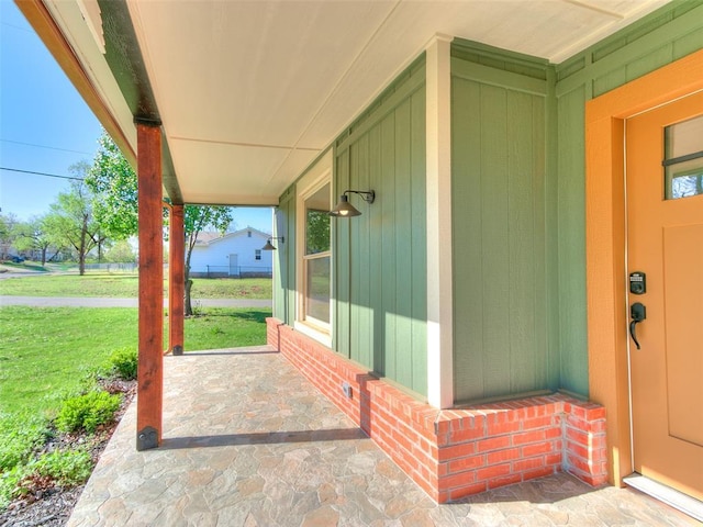 801 N Ash St, Guthrie, OK 73044 - porch featuring a lawn