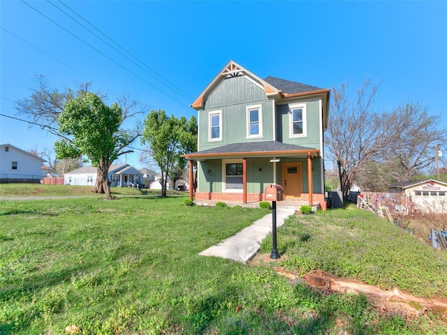 801 N Ash St, Guthrie, OK 73044 - victorian-style house featuring covered porch and a shingled roof