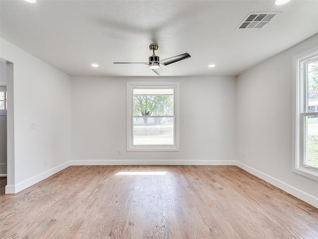 801 N Ash St, Guthrie, OK 73044 - spare room with light wood finished floors, plenty of natural light, baseboards, ceiling fan, and recessed lighting