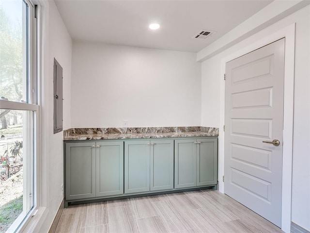 801 N Ash St, Guthrie, OK 73044 - kitchen with electric panel, stone countertops, and recessed lighting