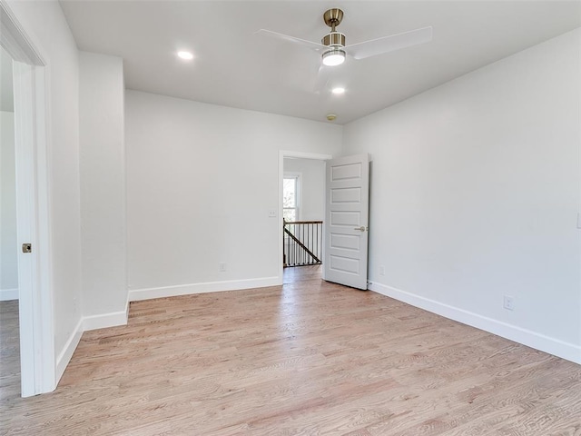 801 N Ash St, Guthrie, OK 73044 - spare room featuring light wood-style flooring, a ceiling fan, baseboards, and recessed lighting