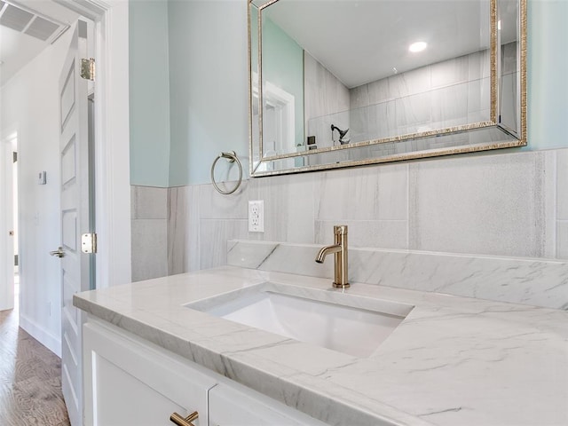 801 N Ash St, Guthrie, OK 73044 - bathroom with vanity and wood finished floors