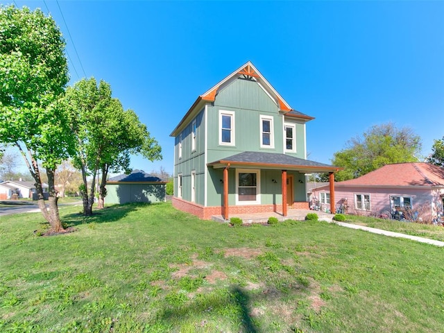 801 N Ash St, Guthrie, OK 73044 - view of front facade with brick siding, covered porch, and a front yard