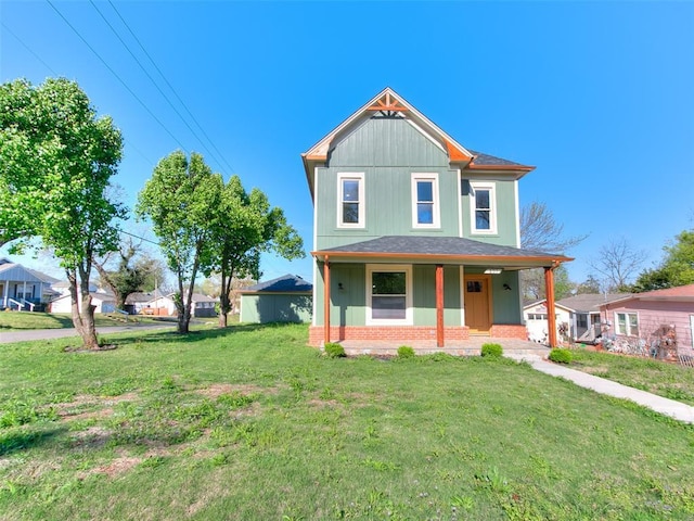 801 N Ash St, Guthrie, OK 73044 - view of front of home featuring a porch, a front yard, brick siding, and roof with shingles