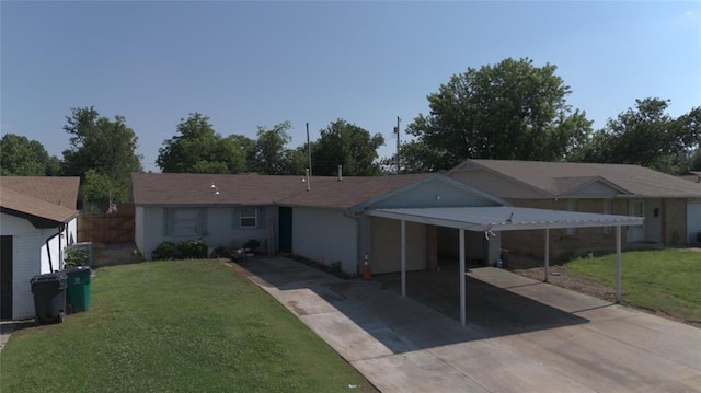 428 NW 91st St, Oklahoma City, OK 73114 - ranch-style house with driveway, an attached carport, and a front yard