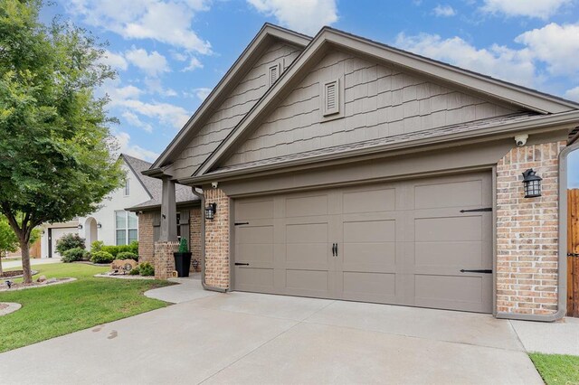 17912 Marron Dr, Edmond, OK 73012 - view of front of property with brick siding, driveway, a front yard, and a garage