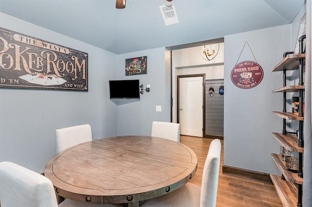 17912 Marron Dr, Edmond, OK 73012 - dining space featuring wood finished floors, a chandelier, and a ceiling fan