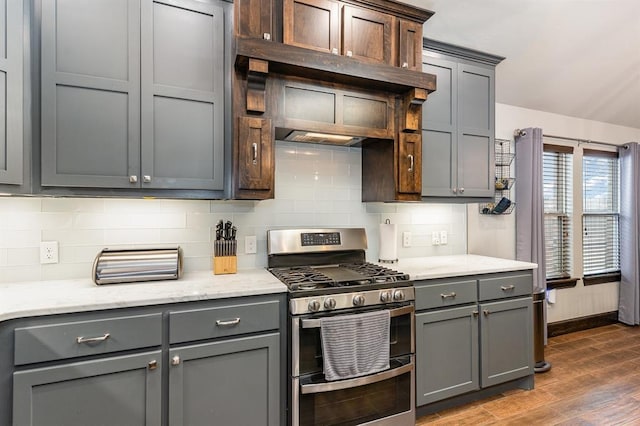 17912 Marron Dr, Edmond, OK 73012 - kitchen featuring range with two ovens, dark wood-type flooring, backsplash, and gray cabinets