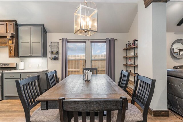 17912 Marron Dr, Edmond, OK 73012 - dining space featuring light wood finished floors and a chandelier