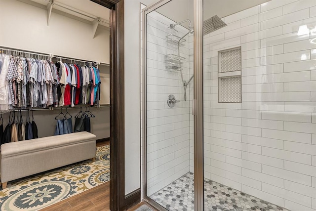 17912 Marron Dr, Edmond, OK 73012 - full bath with a shower stall, wood finished floors, and a walk in closet