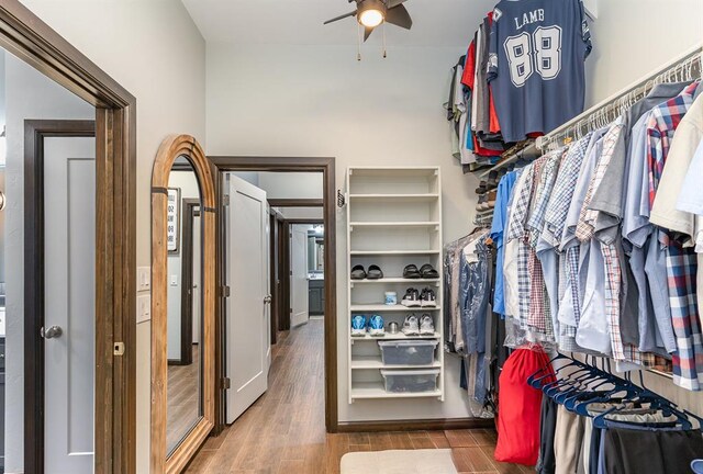 17912 Marron Dr, Edmond, OK 73012 - walk in closet featuring a ceiling fan and wood finished floors