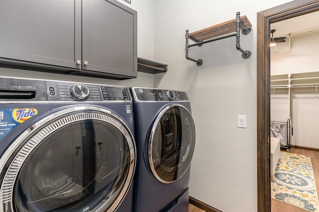 17912 Marron Dr, Edmond, OK 73012 - laundry area featuring washer and dryer, cabinet space, and baseboards
