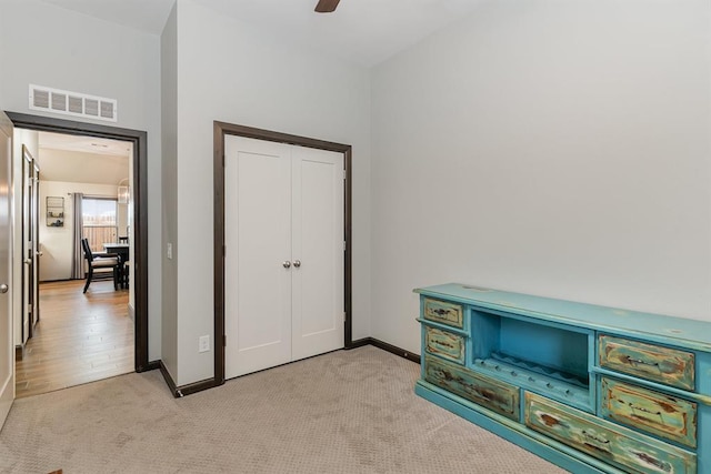 17912 Marron Dr, Edmond, OK 73012 - bedroom with light colored carpet, baseboards, and ceiling fan