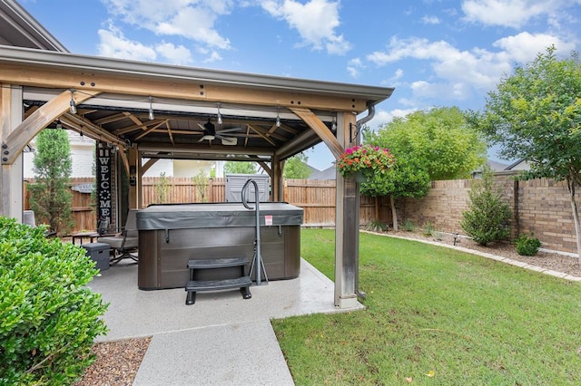 17912 Marron Dr, Edmond, OK 73012 - view of yard featuring a gazebo, a hot tub, a patio, and a ceiling fan