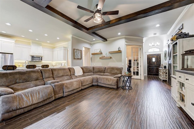 3366 Antler Vly, Guthrie, OK 73044 - living room with a chandelier, beam ceiling, dark wood-style floors, crown molding, and ceiling fan