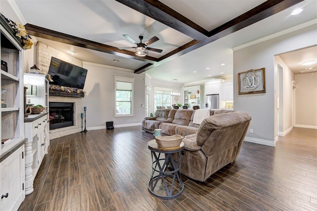 3366 Antler Vly, Guthrie, OK 73044 - living area featuring dark wood-style flooring, a ceiling fan, a fireplace, beam ceiling, and crown molding