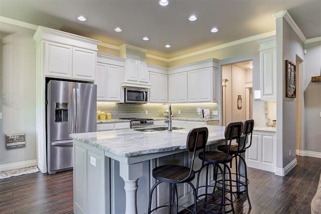 3366 Antler Vly, Guthrie, OK 73044 - kitchen featuring stainless steel appliances, a sink, dark wood-style flooring, white cabinetry, and ornamental molding