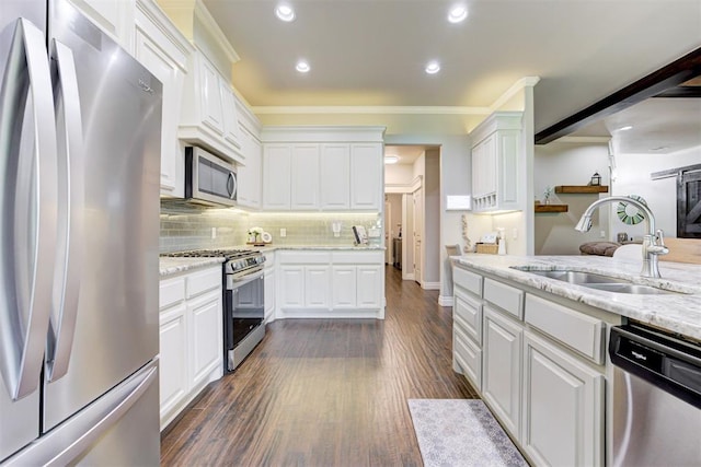 3366 Antler Vly, Guthrie, OK 73044 - kitchen with stainless steel appliances, a sink, white cabinets, recessed lighting, and ornamental molding