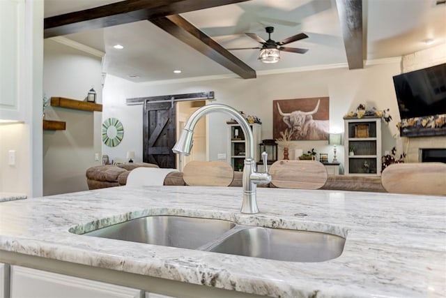 3366 Antler Vly, Guthrie, OK 73044 - kitchen with a sink, open floor plan, beam ceiling, light stone countertops, and recessed lighting