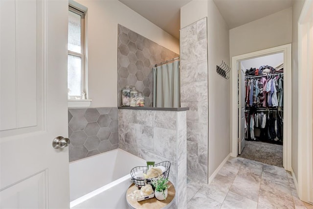 3366 Antler Vly, Guthrie, OK 73044 - bathroom featuring a bath, a tile shower, and a spacious closet