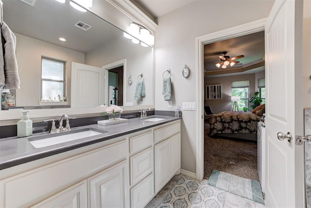 3366 Antler Vly, Guthrie, OK 73044 - ensuite bathroom with double vanity, a ceiling fan, and baseboards