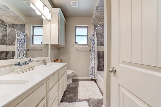 3366 Antler Vly, Guthrie, OK 73044 - bathroom with toilet, double vanity, shower / bath combination with curtain, and baseboards