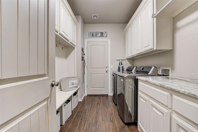 3366 Antler Vly, Guthrie, OK 73044 - laundry area featuring cabinet space, washing machine and dryer, dark wood-style floors, and baseboards