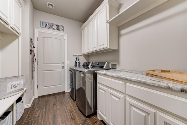 3366 Antler Vly, Guthrie, OK 73044 - laundry area featuring independent washer and dryer, cabinet space, dark wood-style floors, and baseboards