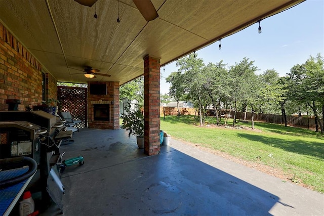 3366 Antler Vly, Guthrie, OK 73044 - view of patio / terrace featuring an outdoor brick fireplace and a ceiling fan