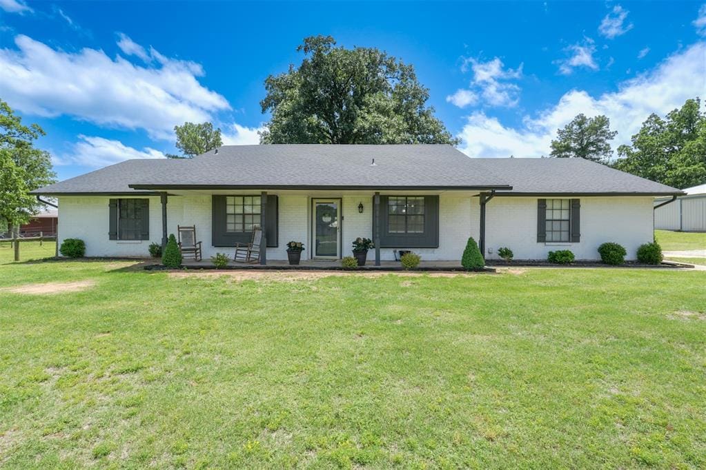 29207 Homer Ln, Mcloud, OK 74851 - ranch-style home featuring a porch and brick siding