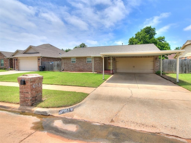 613 S Avery St, Moore, OK 73160 - ranch-style home featuring a garage, brick siding, and concrete driveway