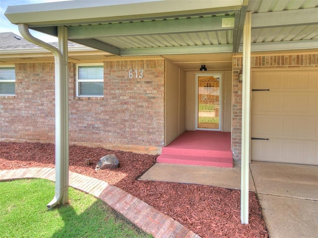613 S Avery St, Moore, OK 73160 - entrance to property featuring brick siding and a garage
