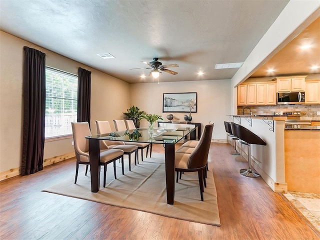 613 S Avery St, Moore, OK 73160 - dining space featuring light wood-style flooring, a ceiling fan, and baseboards