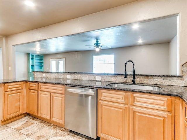 613 S Avery St, Moore, OK 73160 - kitchen featuring stainless steel dishwasher, a sink, ceiling fan, dark stone counters, and backsplash