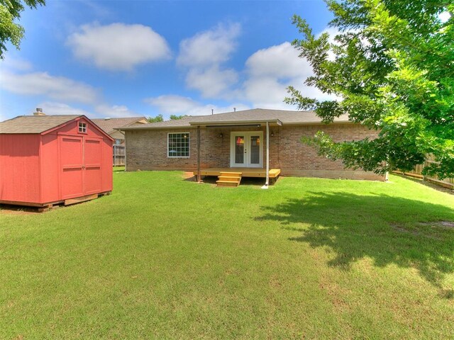 613 S Avery St, Moore, OK 73160 - rear view of house with french doors and brick siding
