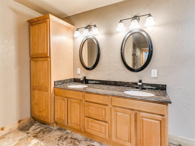613 S Avery St, Moore, OK 73160 - full bathroom with double vanity and baseboards