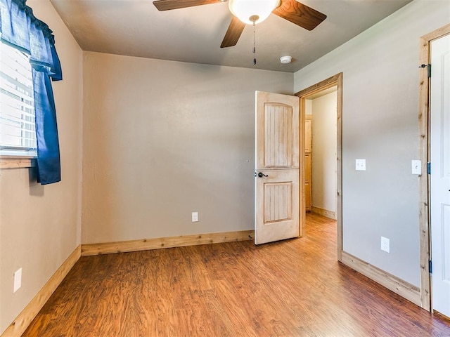 613 S Avery St, Moore, OK 73160 - unfurnished room featuring ceiling fan, wood finished floors, baseboards, and a smoke detector