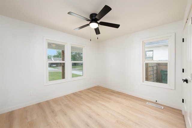 1828 NW 38th St, Oklahoma City, OK 73118 - unfurnished room with healthy amount of natural light, light wood-style flooring, and ceiling fan