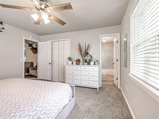 621 W 2nd St, Calumet, OK 73014 - bedroom with a closet, light carpet, connected bathroom, ceiling fan, and baseboards