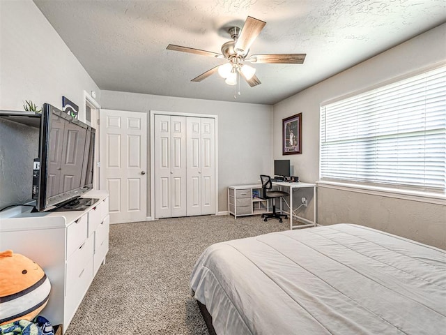 621 W 2nd St, Calumet, OK 73014 - carpeted bedroom with a closet, a ceiling fan, and a textured ceiling