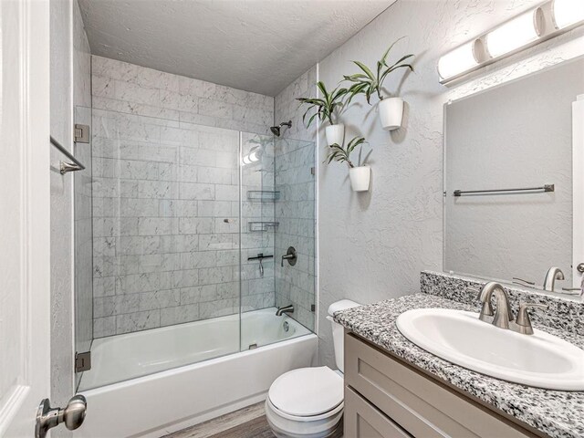 621 W 2nd St, Calumet, OK 73014 - full bathroom featuring toilet, vanity, a textured ceiling, a textured wall, and shower / bathtub combination