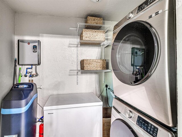 621 W 2nd St, Calumet, OK 73014 - laundry room with stacked washing machine and dryer and a textured wall