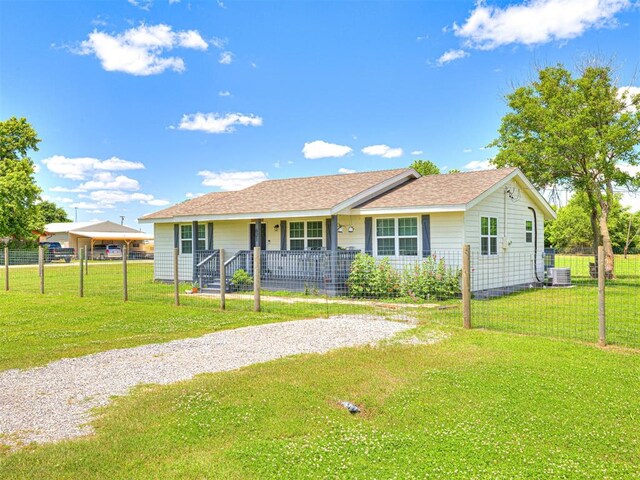 621 W 2nd St, Calumet, OK 73014 - ranch-style house featuring a porch, central AC, and a shingled roof