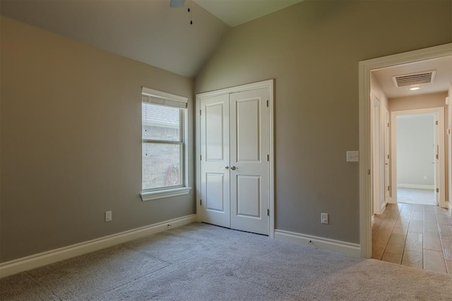 12916 Ponderosa Blvd, Oklahoma City, OK 73142 - unfurnished bedroom with baseboards, lofted ceiling, carpet floors, and a closet
