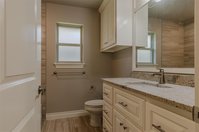 12916 Ponderosa Blvd, Oklahoma City, OK 73142 - bathroom with vanity, toilet, and baseboards