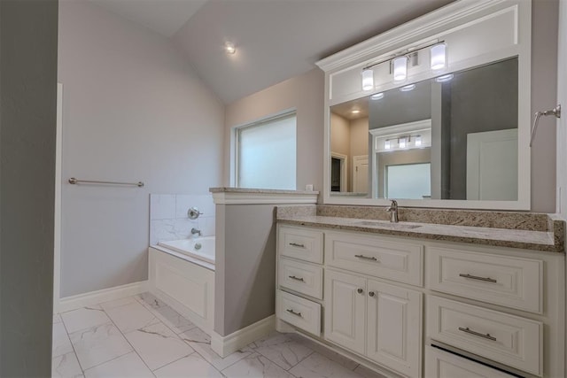 12916 Ponderosa Blvd, Oklahoma City, OK 73142 - bathroom with vaulted ceiling, a bath, vanity, marble finish flooring, and baseboards