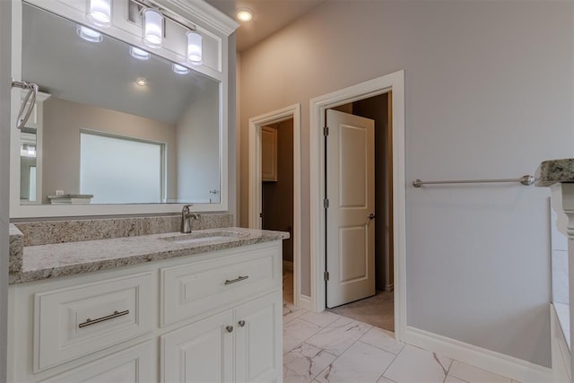 12916 Ponderosa Blvd, Oklahoma City, OK 73142 - bathroom with vanity, marble look tiles, and baseboards