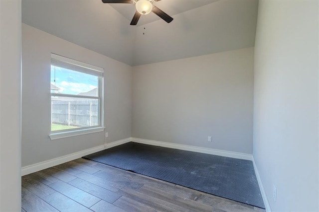 12916 Ponderosa Blvd, Oklahoma City, OK 73142 - spare room with ceiling fan, wood finished floors, baseboards, and vaulted ceiling