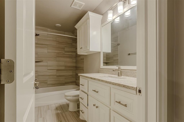 12916 Ponderosa Blvd, Oklahoma City, OK 73142 - bathroom featuring vanity, toilet, and bathing tub / shower combination